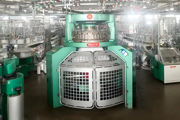 Close-up view of textile machinery used for precision weaving and stable fabric production