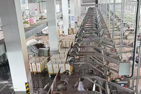 Fabric inspection and sorting area ensuring quality control before storage and shipment at lanfex