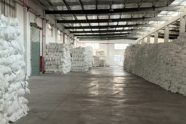 Spandex and polyester yarn storage area supporting lanfex’s integrated fabric manufacturing